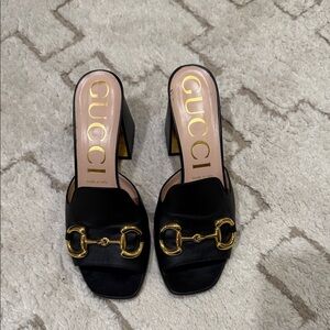 Gucci Black Mules with Gold Accents